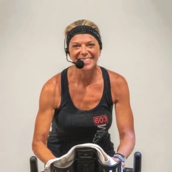Colleen on a Spin bike