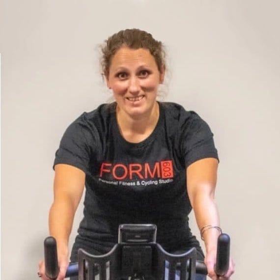 Hannah on a Spin bike
